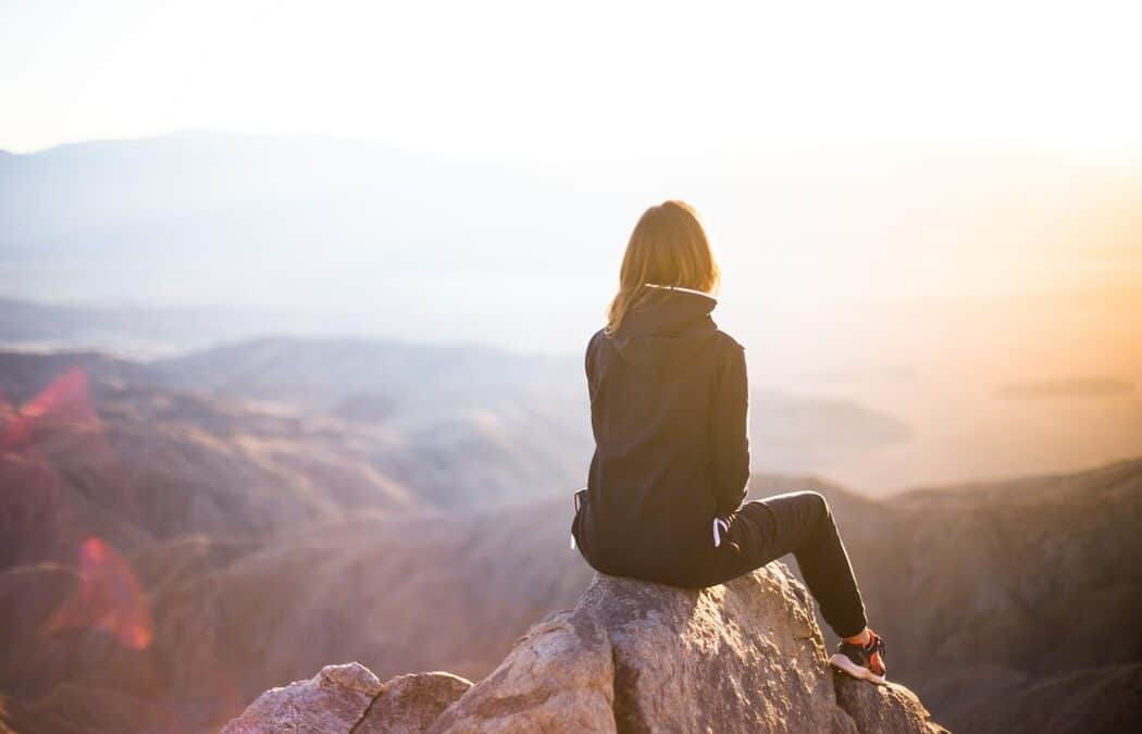 Person sitting at their dream destination